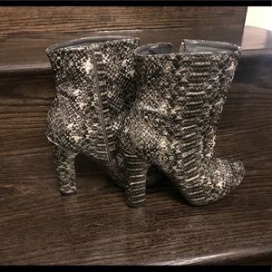 Faux snakeskin leather boots with heel. Worn once.